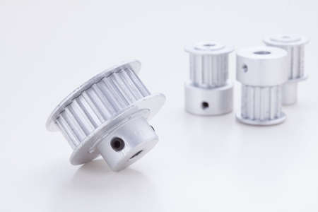 timing pulleys on white の写真素材