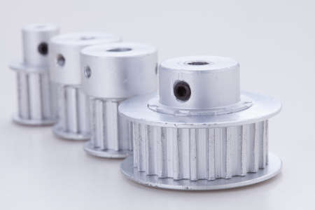 timing pulleys on white の写真素材