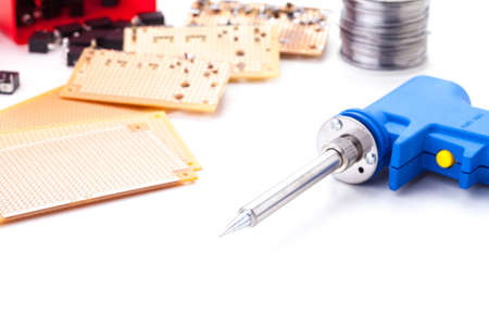 Soldering Gun Shape Placed on a white background isolated with electronic devices and consumer electronics such as audio jack and power jack female put together .の写真素材