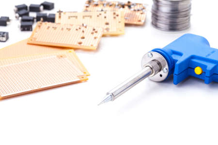 Soldering Gun Shape Placed on a white background isolated with electronic devices and consumer electronics such as audio jack and power jack female put together .の写真素材