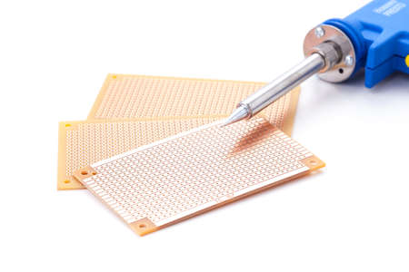 Soldering Gun Shape placed on the pcb. Electronic printed board.の写真素材