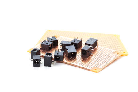 dc power jack and audio jack female placed on the pcb. Electronic printed board. Soldering iron is backgroundの写真素材