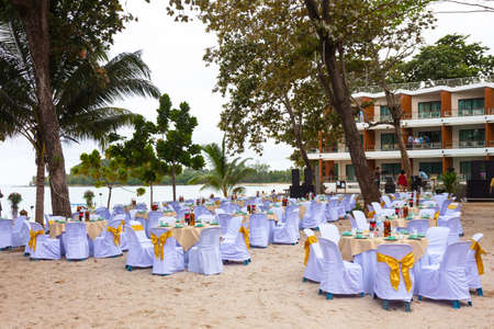 Decorated table for a wedding reception at beach resortの写真素材