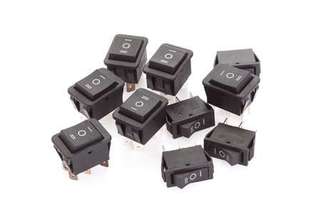 6 pin dpdt on-off-on Rocker switch on white backgroud. The color is blackの写真素材