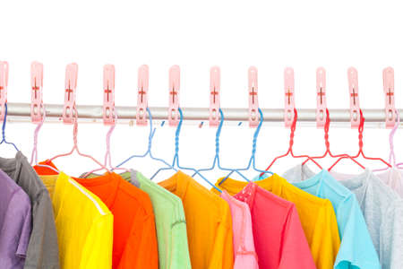 Multi-colored T-shirts hanging on a clothes line . After washing doneの写真素材
