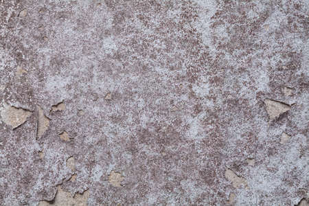 Old white concrete wall. Paint peeling off the walls , old and fungus.の写真素材