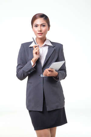 asian business women working hold digital tablet. shot on white backgroundの写真素材