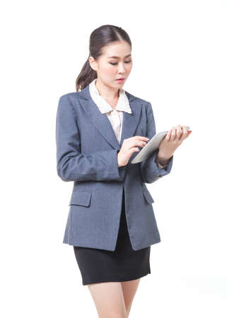 asian business women working with digital tablet. shot on white backgroundの写真素材