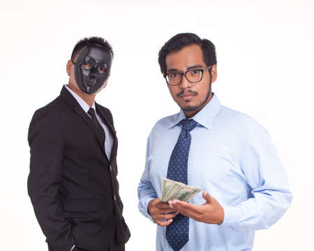 businessman holding US bank note.Getting money by corruptionの写真素材