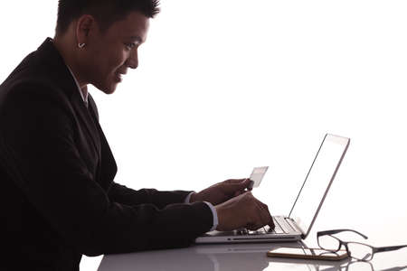 silhouette young business man making online paymentの写真素材