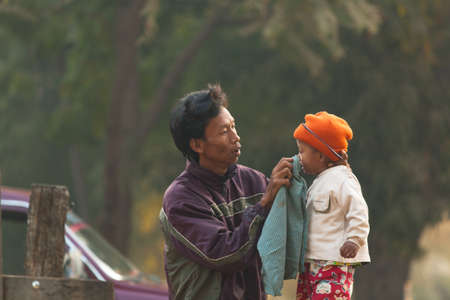 BAGAN, MYANMAR - JANUARY 25: People life in Yong U Market, is a morning market selling rice, fish, vegetables, flower, clothes, souvenirs on January 25, 2009 in Bagan Myanmar.のeditorial素材