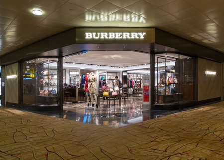 Singapore - July 31: A Burberry outlet, July 31,2016, Changi International airport, Terminal 2, International departure, Singapore.のeditorial素材