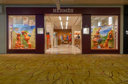 Singapore - July 31: A HERMES outlet, July 31,2016, Changi International airport, Singapore. Herme's was established in 1837 and is a French manufacturer of leather, lifestyle accessories, perfumery and luxury goods.のeditorial素材