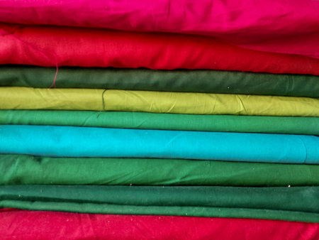 Lots red, green, blue, yellow, pink and other of clothes for sewed