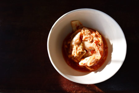 Kimchi in a bowl on wooden table brown,Korean foodの写真素材