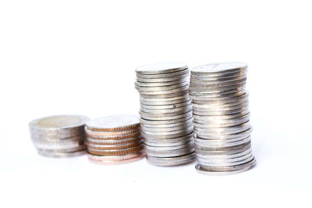 Four stacks coins row on white background,Business and financeの写真素材