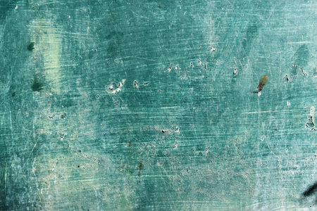 Green surface with white scratches ,Grunge background and  texture of old metal for add text or graphic designの写真素材