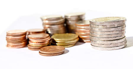 Many stacks of coins in various sizes and valued,Business and financeの写真素材