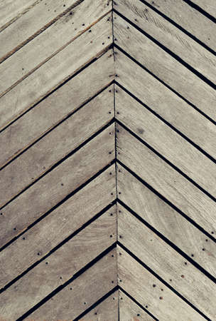 The quirk black line pointing up and stacked stacked parallel to each lot,Old and rust grunge wooden plank as background.,Texture for add text or graphic designの写真素材