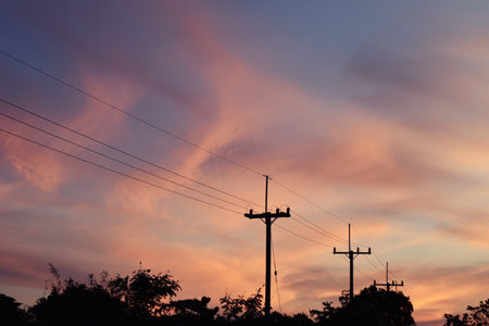 Electricity poles at the roadside with beautiful blue sky before sunset,Photos back - light at the...
