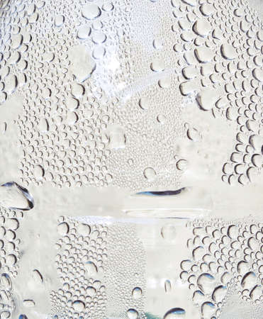 Many water drops on the surface of a transparent bottle, Texture for add text or graphic designの写真素材