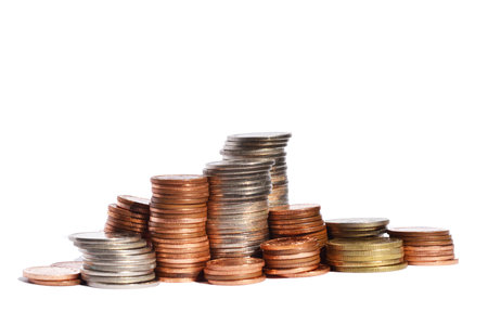 Many stacks of coins in various sizes and valued isolated on white background, Financial and commit...