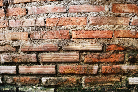 Background and Texture from Vintage red brick wall is deteriorating