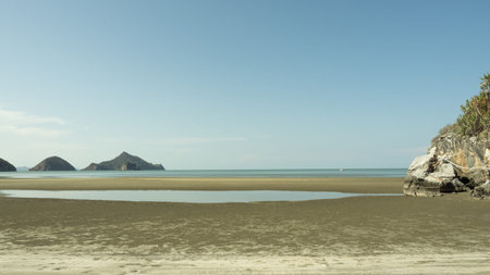 Calming sea with mountain with island and blue sky in background at Bang Pu Beach, Khao Sam Roi Yot...