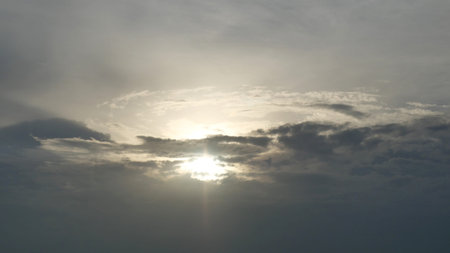 Dramatic dark clouds at sunset, The sun shine as the cloud moves across, Sunbeam on gray color sky,...