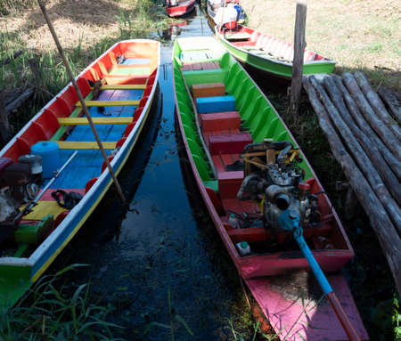 Colorful fishing and Taxi boat with water plants in lake, Wetland at Khao Sam Roi Yot National Park, Thailandの写真素材