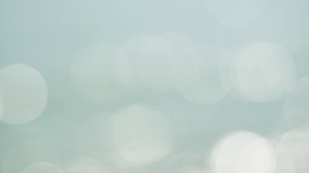 Soft pastel blue color with white shining circle background, Twinkling light shiny for party...