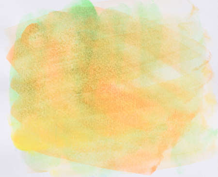 Watercolor stroke and spray on white paper , Abstract background by hand drawn yellow with green and orange color liquid dripの写真素材