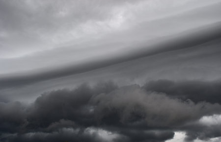 Arcus cloud rolling in the storm, Cumulonimbus cloud formations on tropical sky , Nimbus moving ,...