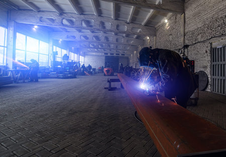 Industrial Worker at the factory welding closeup