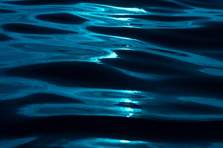 macro texture of the water surface, blue sea waves.