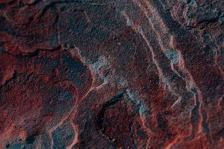 Stone textures. Dark orange banner. Colorful mountain texture. Close-up. Voluminous. Abstract rock background. Macro detail of the rock.の写真素材