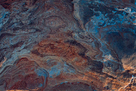 Stone textures. Dark orange banner. Colorful mountain texture. Close-up. Voluminous. Abstract rock background. Macro detail of the rock.の写真素材