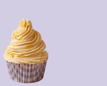 crream butter vanilla cupcake in purple backgroundの写真素材