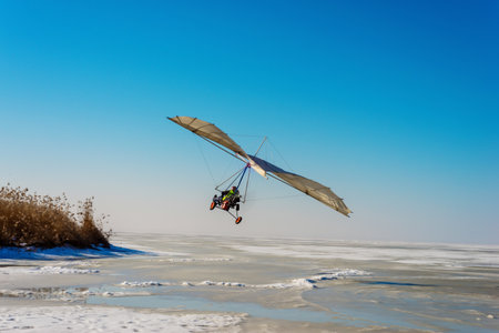 White sport hang glider on an ice fieldの写真素材