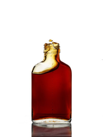 bottle of red wine isolated on a white backgroundの写真素材