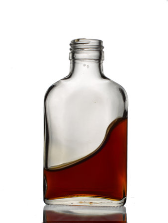 bottle of whiskey on a white background with reflection, isolate.の写真素材