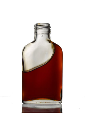 bottle of whiskey on a white background with reflection, isolated objectの写真素材