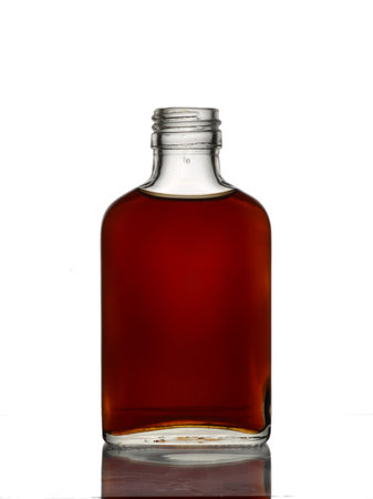 bottle of cognac isolated on a white backgroundの写真素材