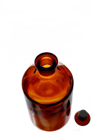 Brown glass bottle on a white background. close-up image.の写真素材