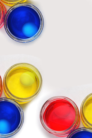 Colorful watercolors in glass jars on a white background.の写真素材