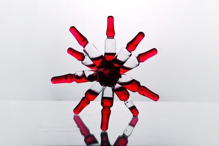 Red glass medical ampoules on a white background with reflection.の写真素材
