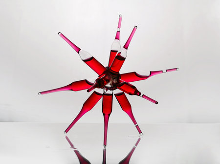 3d render of a red glass flower on a white background.の写真素材