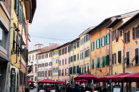 A very colorful restaurant street in the city center of Pisa, Italy.のeditorial素材