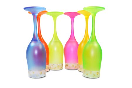 Six isolated colored tall wine glasses in semicircleの写真素材