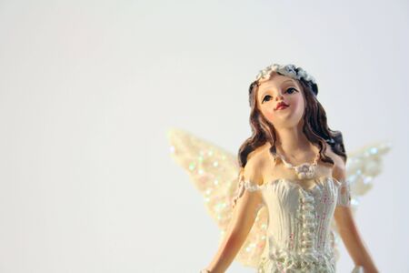 Figurine of an angel on grey backgroundの写真素材